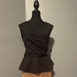 Black fitted top that flare at the waist with belt.